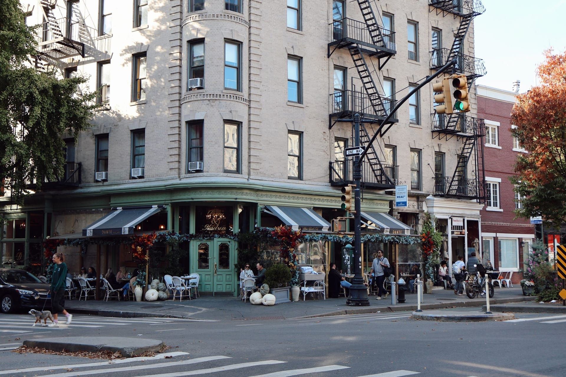 Corner building with a café and shops on the ground floor and apartments above